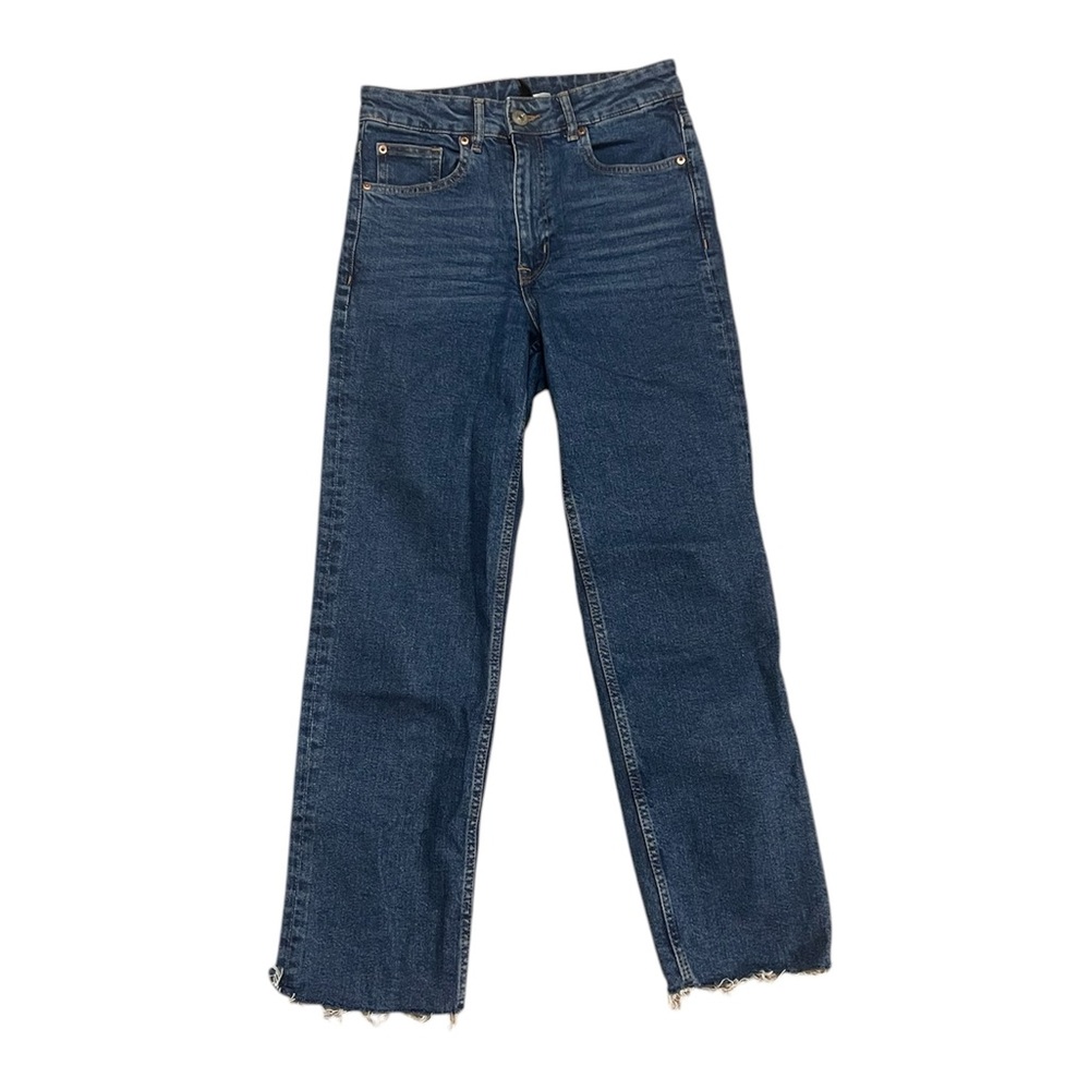 Medium wash straight leg jeans with raw frayed hem